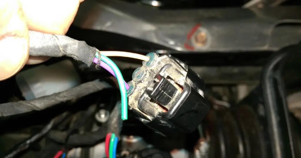 A Damaged wiring harness on a Polaris Ranger EV
