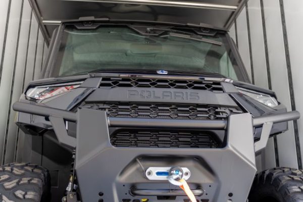 Polaris Ranger front grill close-up with rugged bumper and winch system for off-road utility